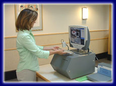 Photo of woman using Express Checkout machine