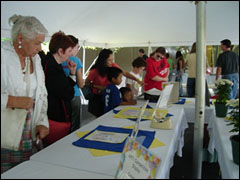 photo of people viewing art contest submissions