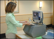 Photo of woman using Express Checkout machine